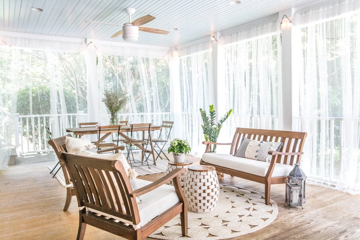 summer back porch with mosquito net curtains