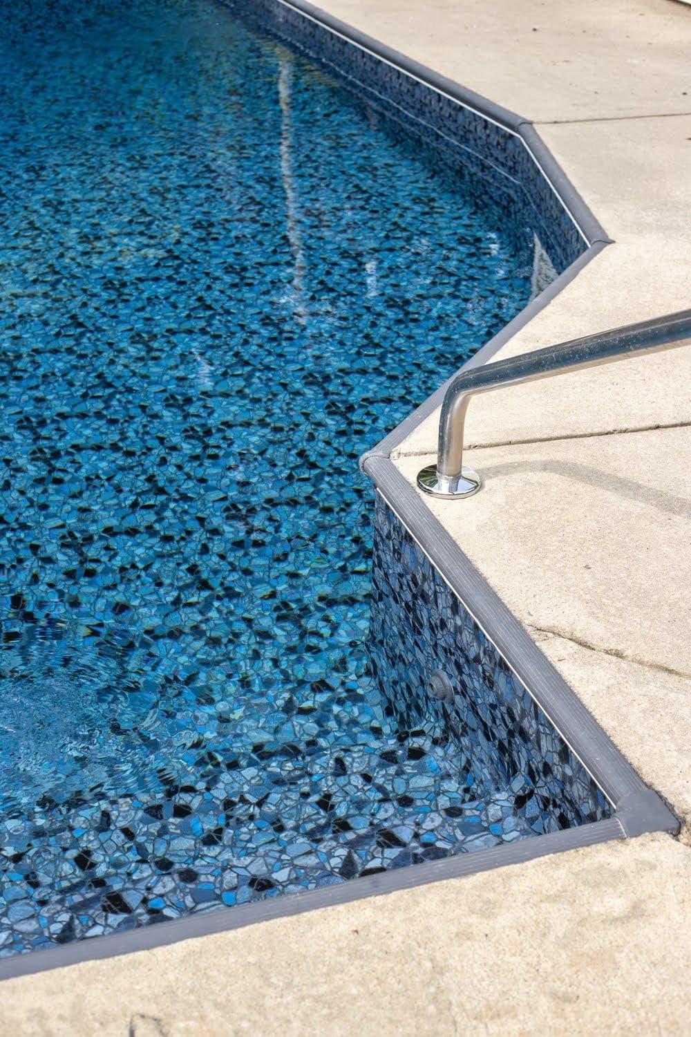 Swimming Pool Liner Makeover Reveal | TrueStone Collection - Obsidian from GLI Pool Products and charcoal gray painted coping strip