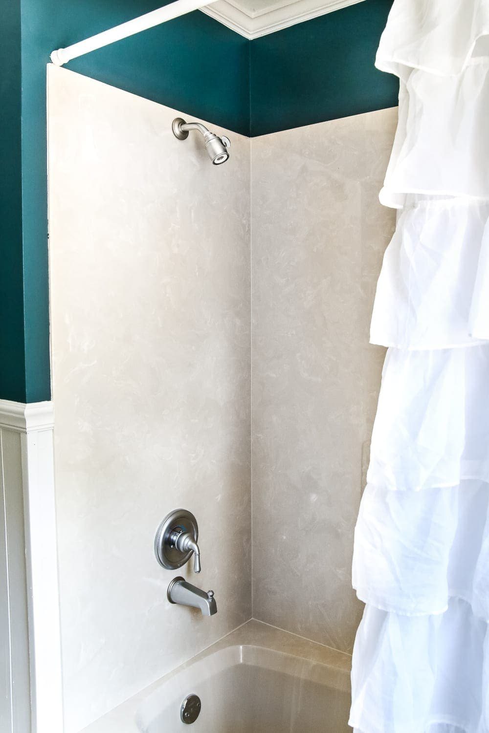 Teal Painted Bathroom Makeover | unigumushane.com - A boring, dated beige bathroom gets a fresh teal painted makeover with Magnolia Home Paint in the color Weekend and Ben Moore Simply White and Wrought Iron.