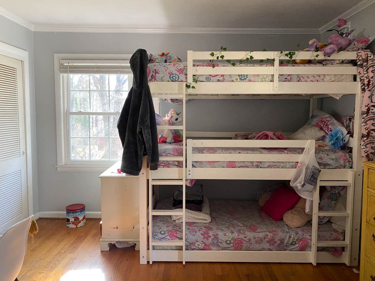 triple bunk bed in shared teenage bedroom before