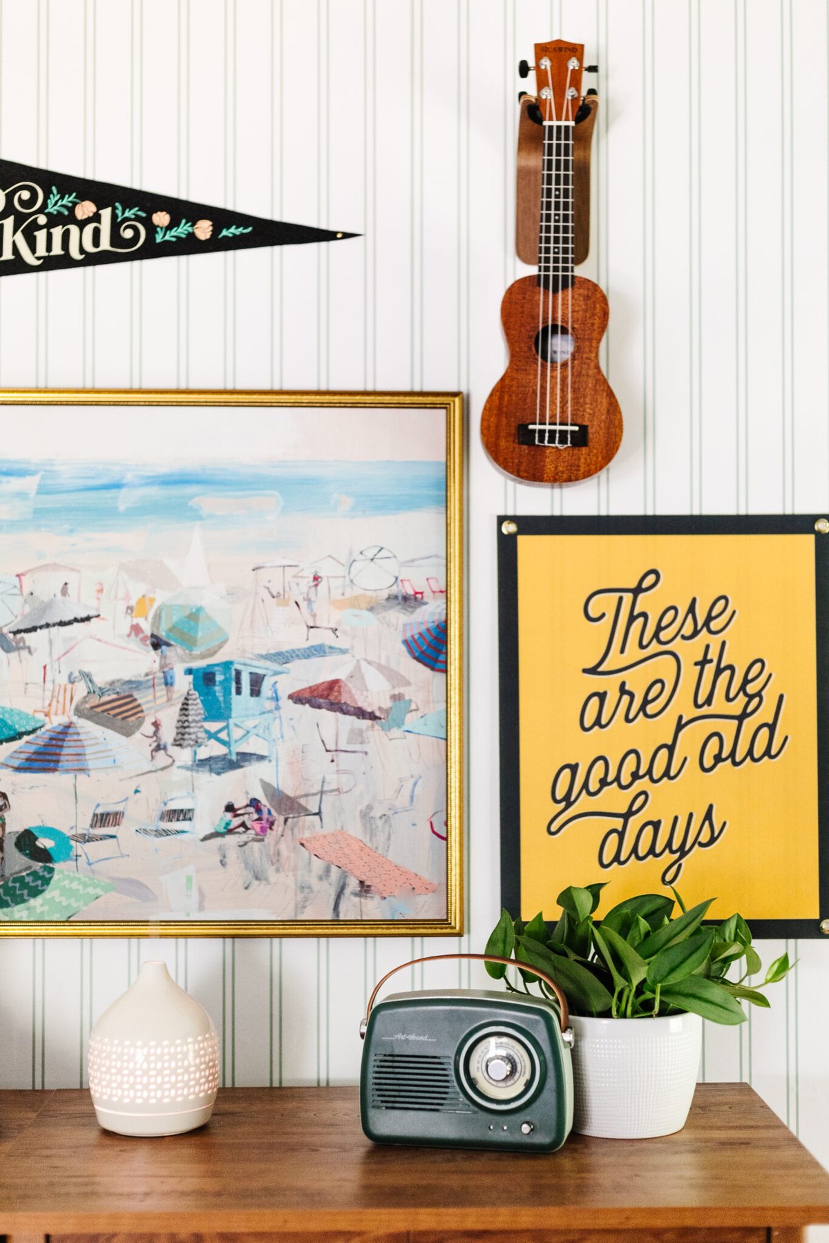 wireless speaker radio on dresser with gallery wall in teenage beach themed bedroom