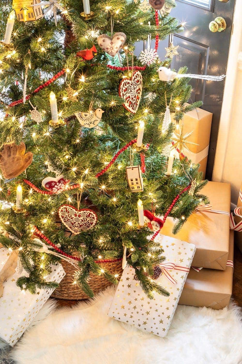 artificial Christmas tree with Scandinavian ornaments and garland