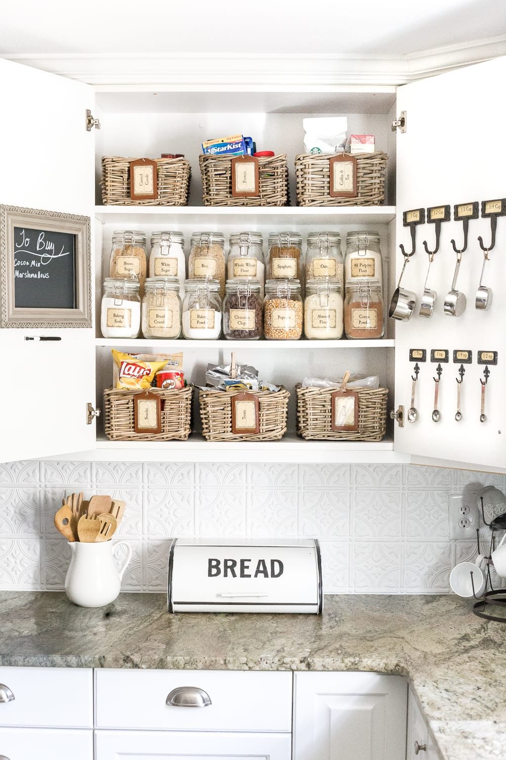 Pantry Cabinet Organization and Free Printable Label Set | unigumushane.com - A cabinet gets a drastic organization makeover using inexpensive IKEA jars / baskets, hanging storage, and a free pantry label printable set. #organization