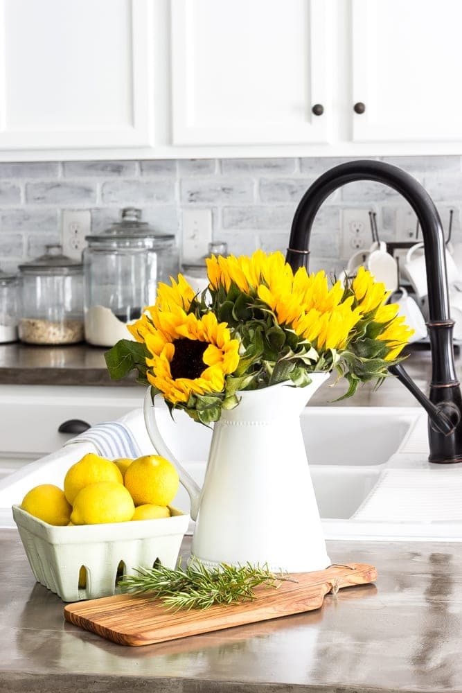 classic white pitcher with sunflowers
