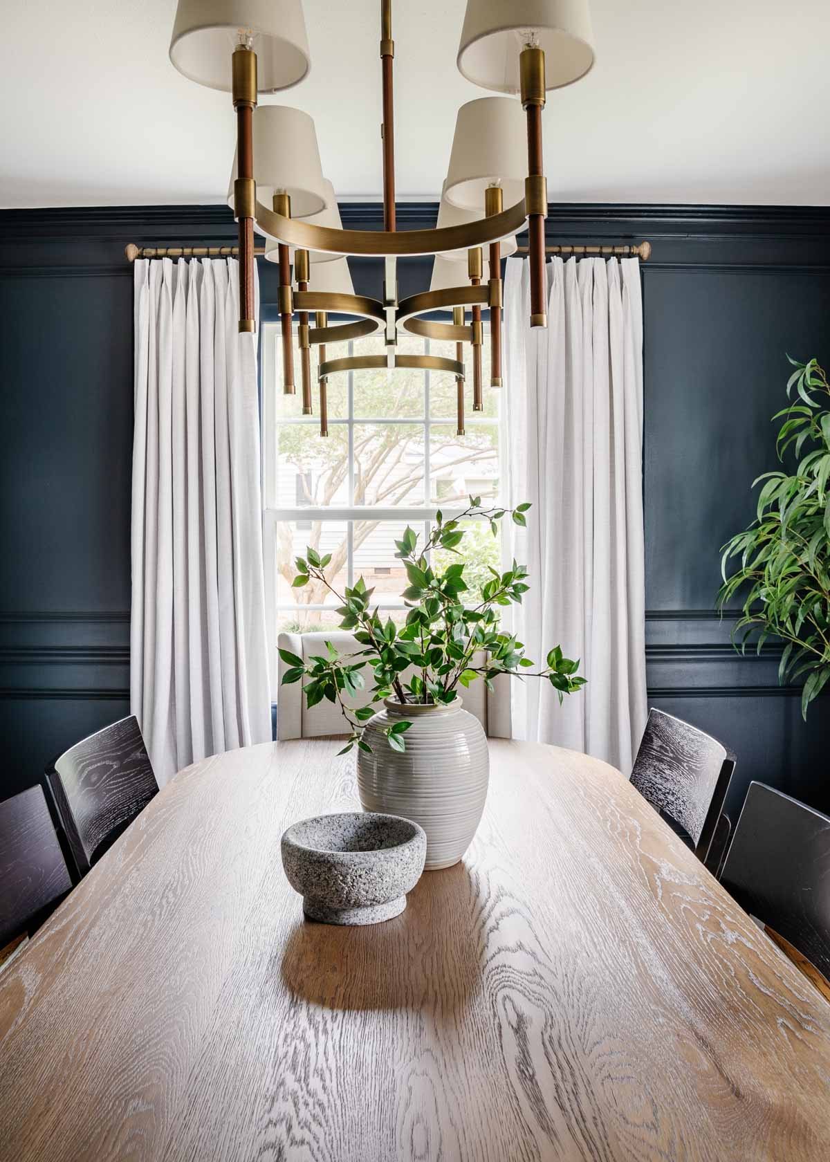 navy blue dining room with linen curtains