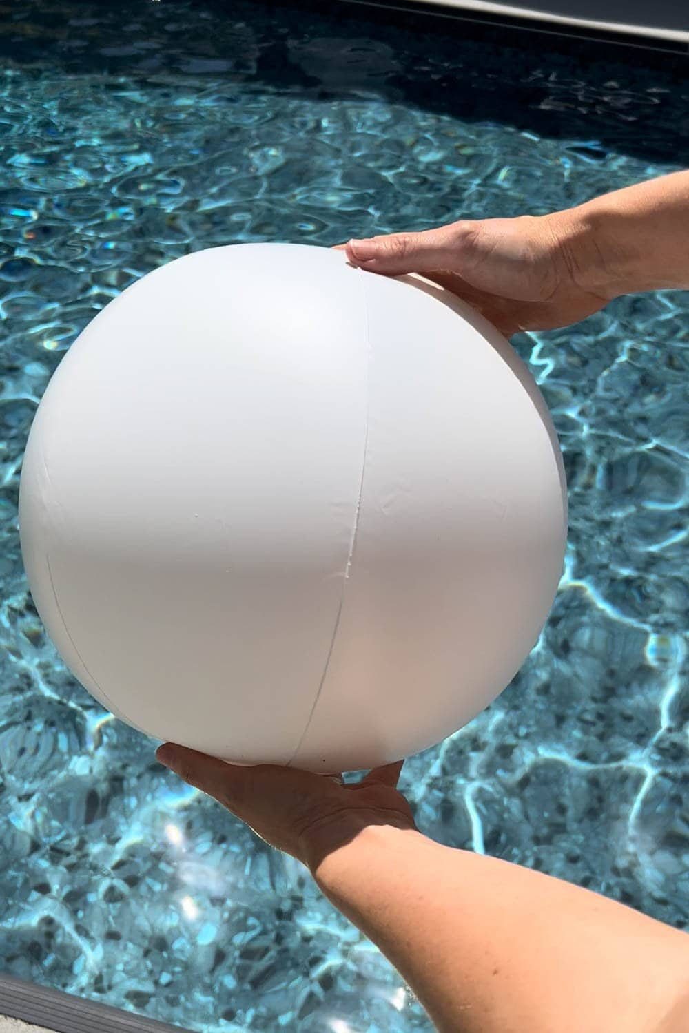 white beach ball over water