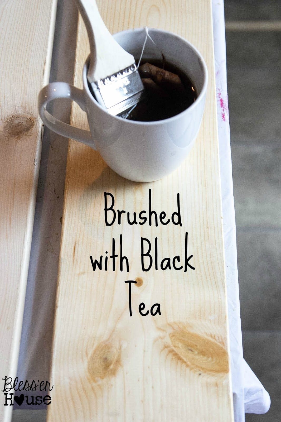 The first step in this all natural wood stain method is to brush the lumber with the black tea, steeped for over 24 hours.