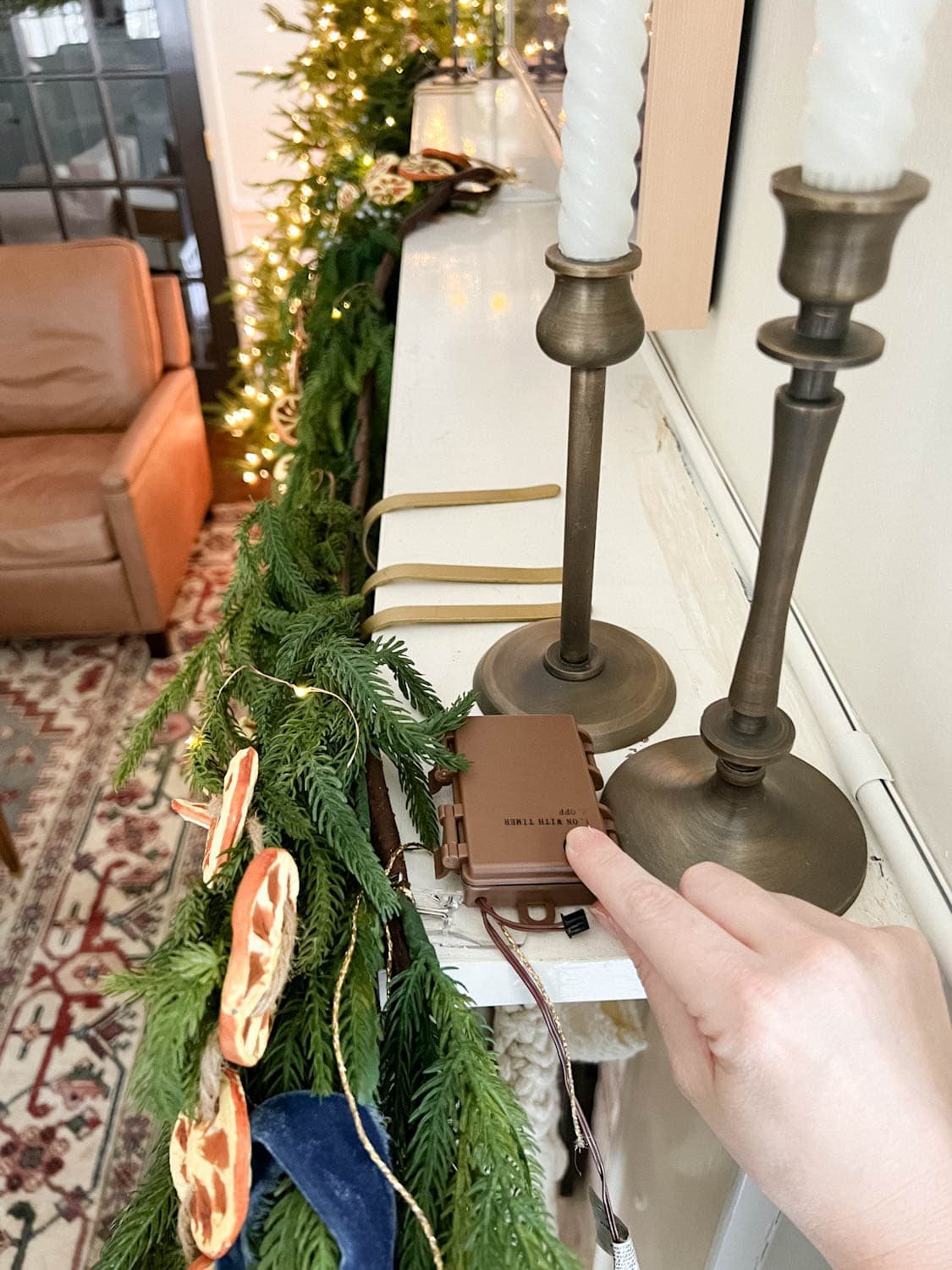 attaching fairy light battery pack to mantel with Command strip
