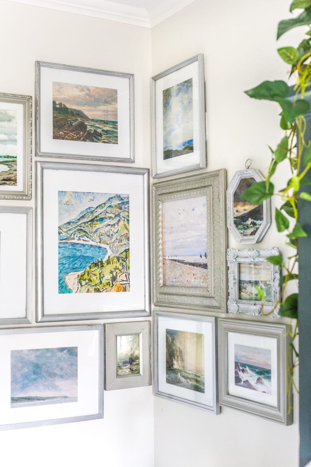 Budget Master Bathroom Refresh Reveal | corner gallery wall with thrifted frames and free coastal art printables