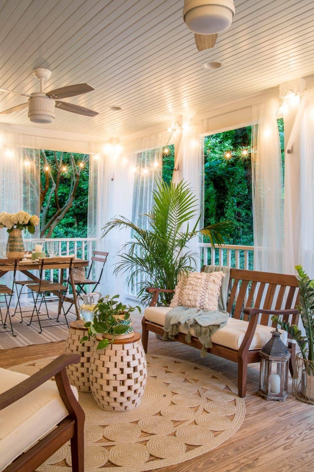 A tropical boho back porch decorated for summer with breezy, functional style from Walmart's Flower Home line by Drew Barrymore and string lights for evening ambience. #backporch #summerdecor