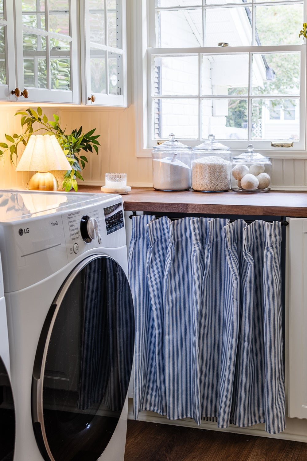 ticking stripe vintage cabinet skirt in laundry room