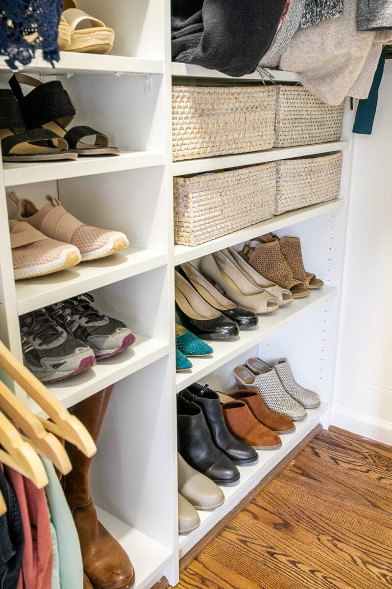 shoes on shelves in a closet