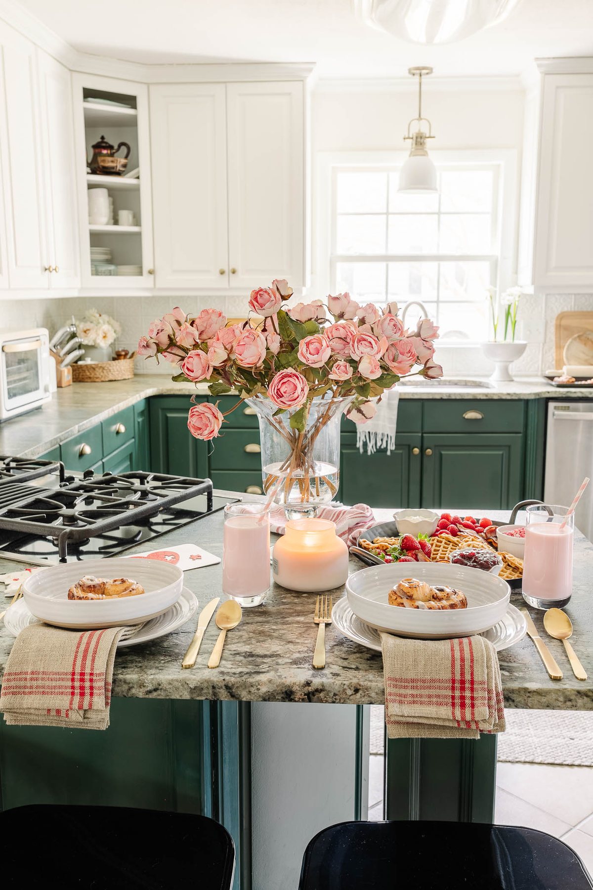 Valentine's Day breakfast charcuterie board for kids at a kitchen bar with flowers and candles
