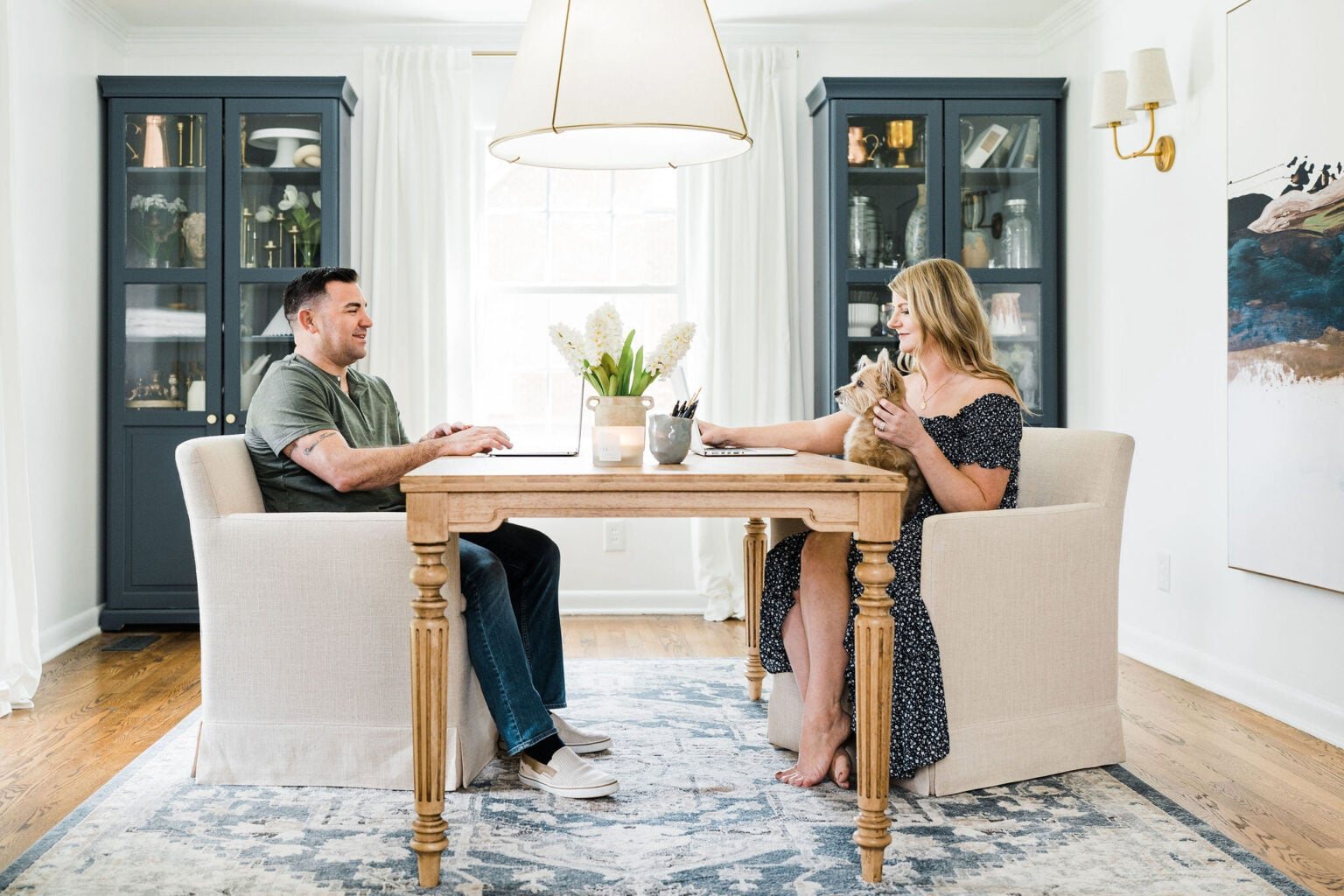 home bloggers' office for two with table two desk chairs and storage cabinets