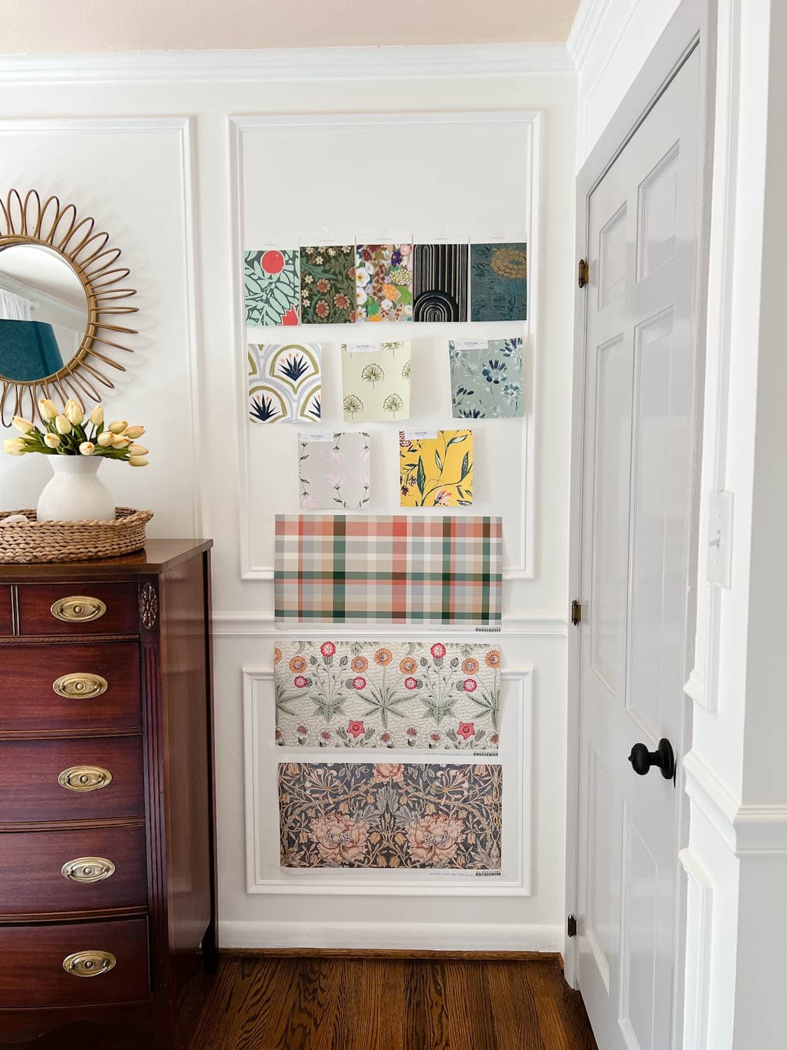 vintage style wallpaper swatches on a bedroom wall