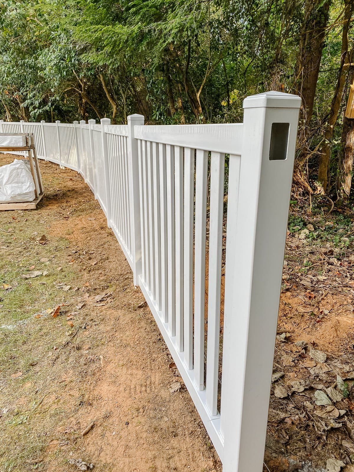 white vinyl fence installation with Ply Gem