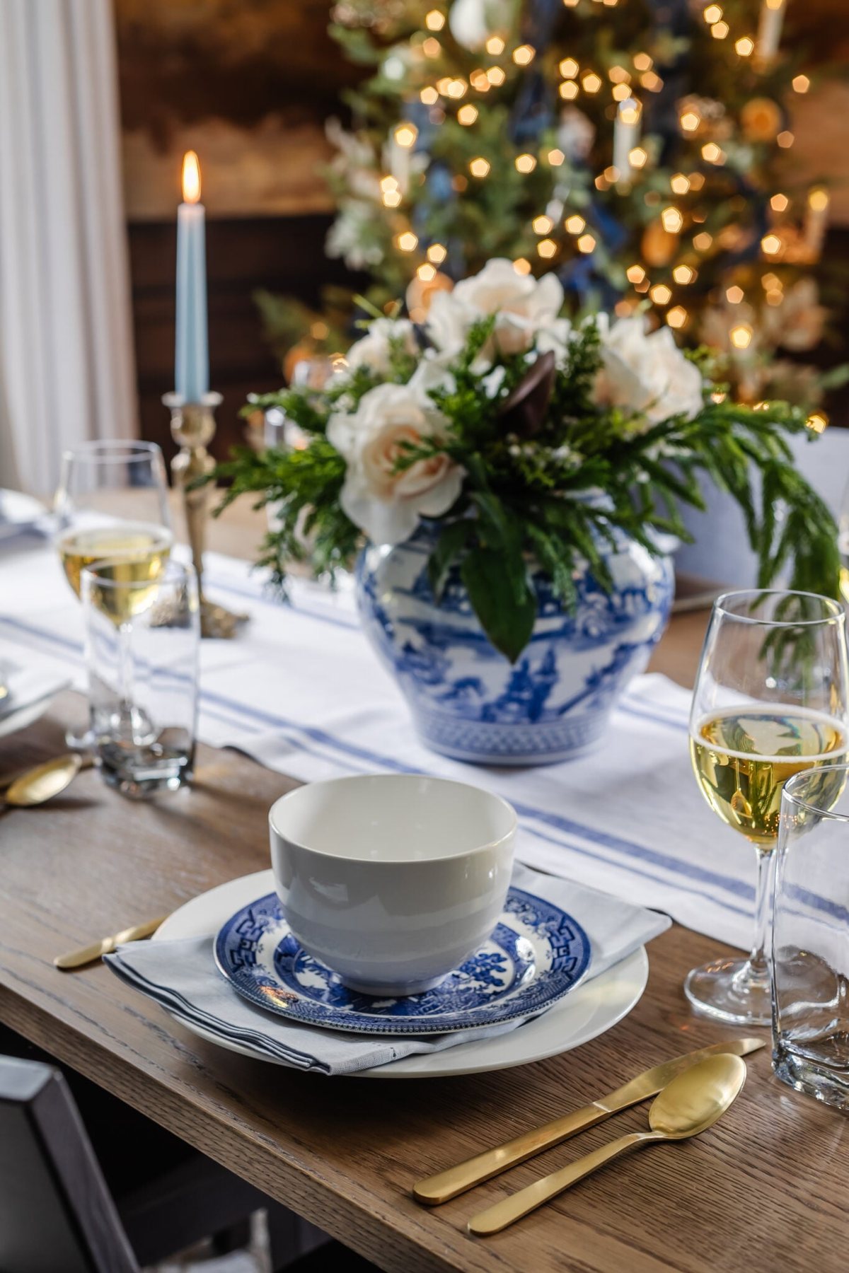white and blue Christmas dinner table place setting