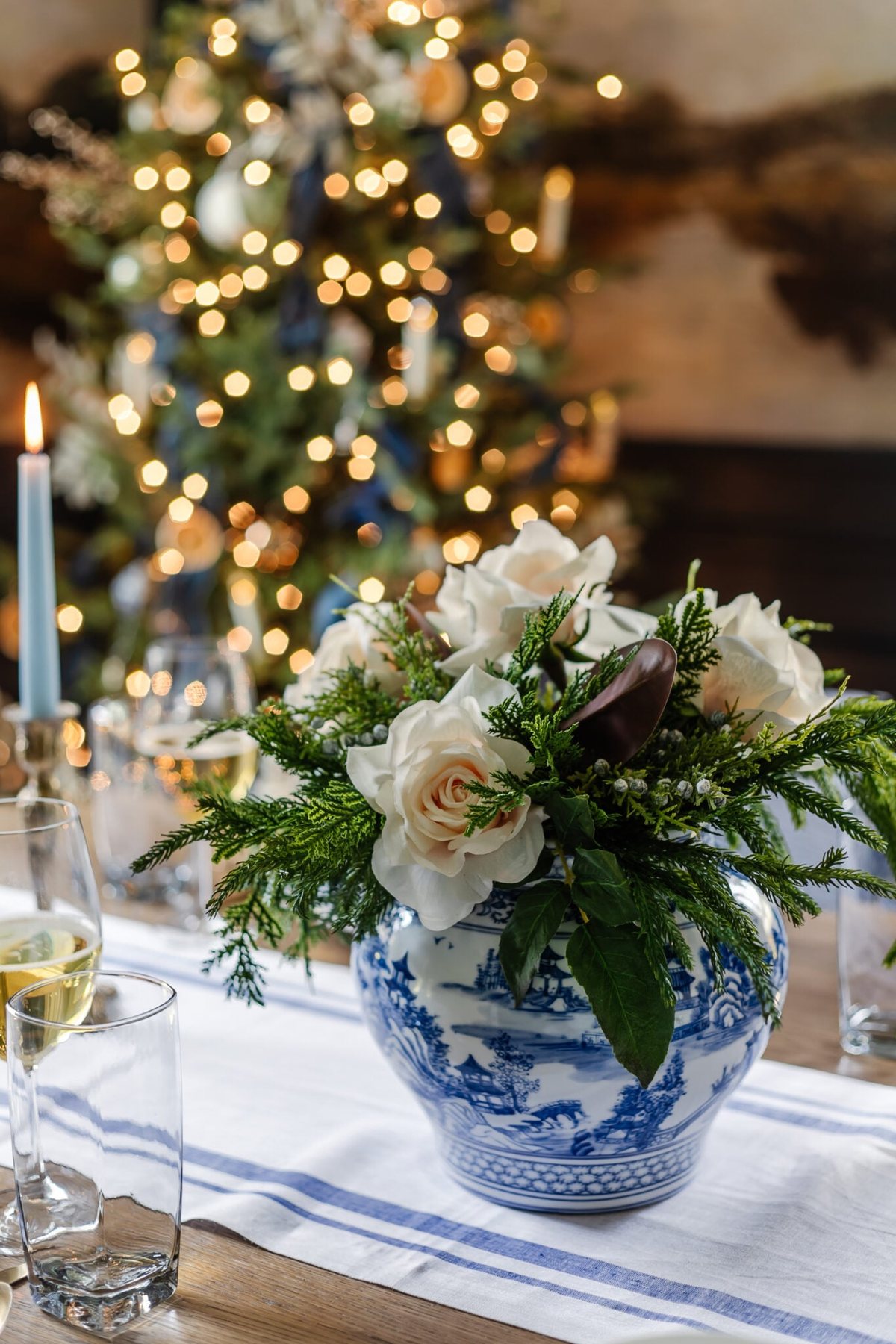 white and blue vase for centerpiece on Christmas dinner table