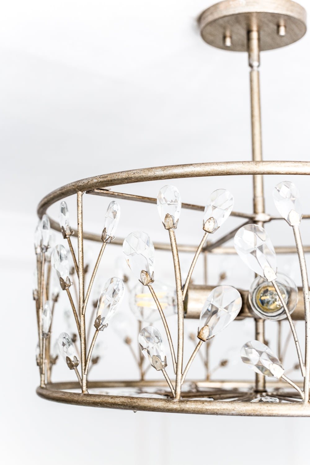 A feminine, vintage, glam lighting update for a baby girl's nursery makeover. #nurserylighting #lightfixture #glamdecor #vintagedecor