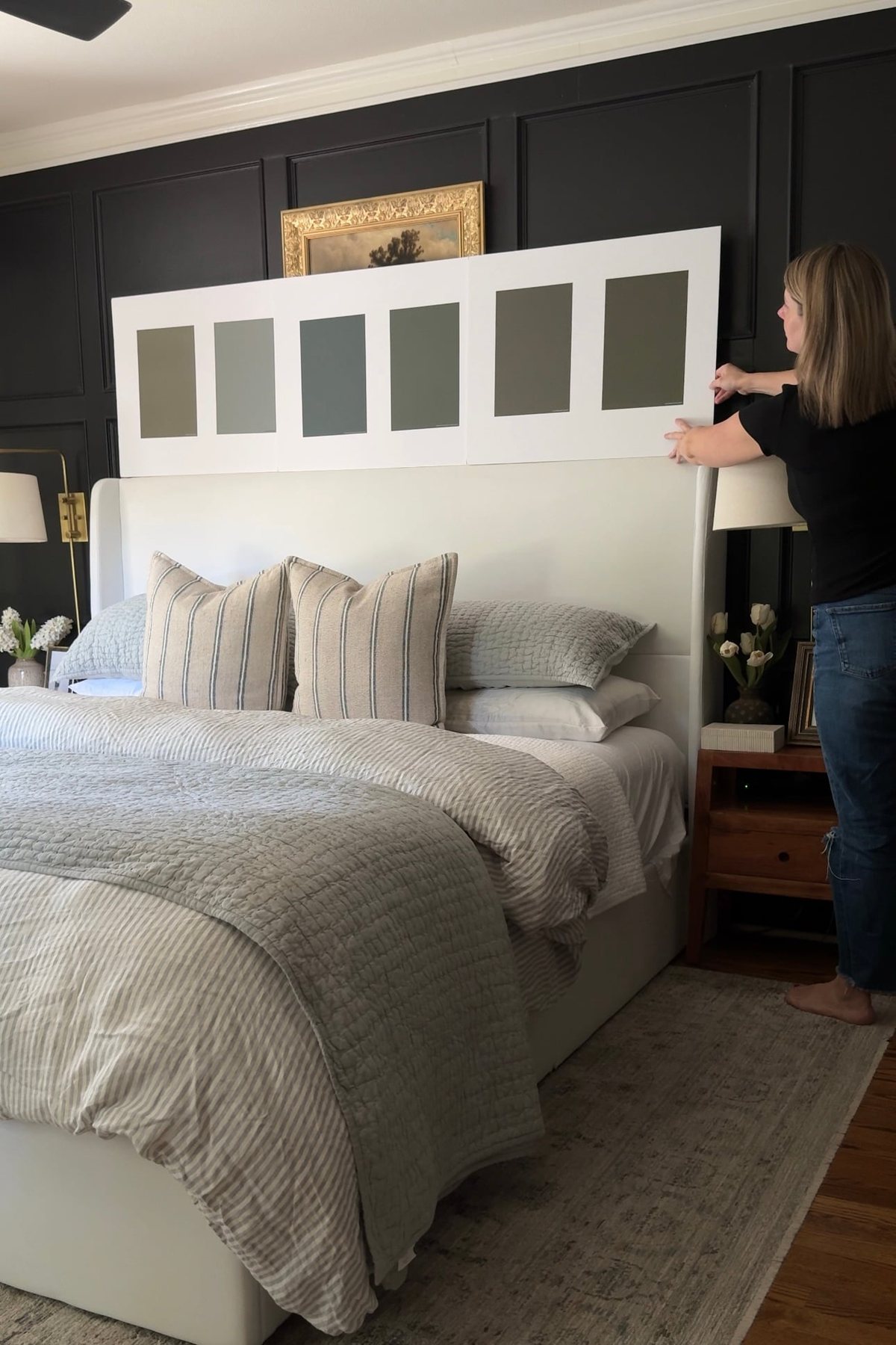 testing olive green paint colors in a bedroom on white board