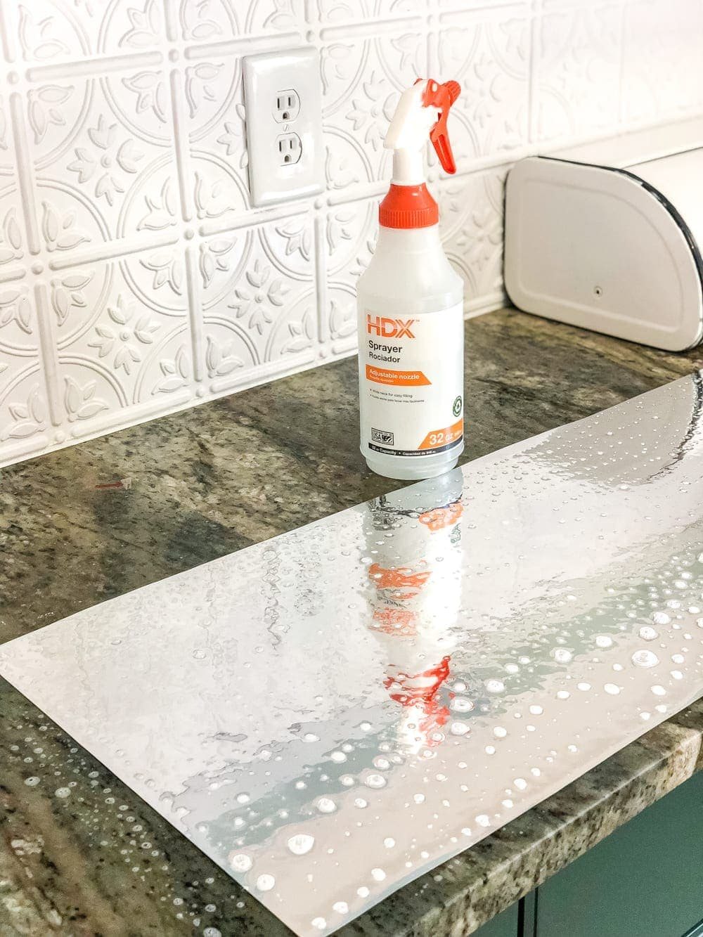applying antique mirror film by spritzing with water in a spray bottle