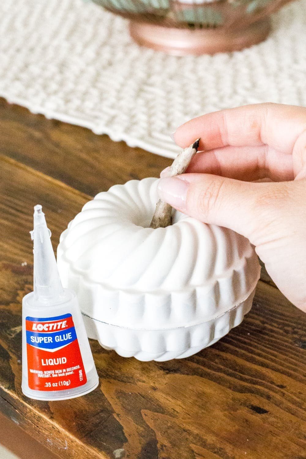 glue two mini bundt pan Jello molds together and stick a twig in the top to make a DIY mini pumpkin