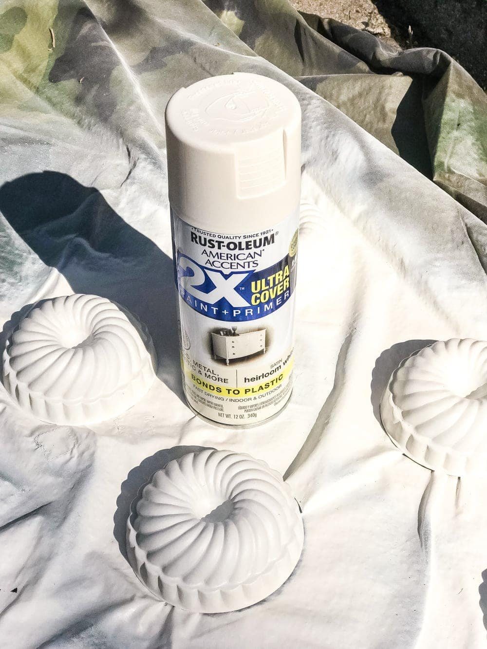 white spray painted mini bundt pan Jello molds to make craft pumpkins
