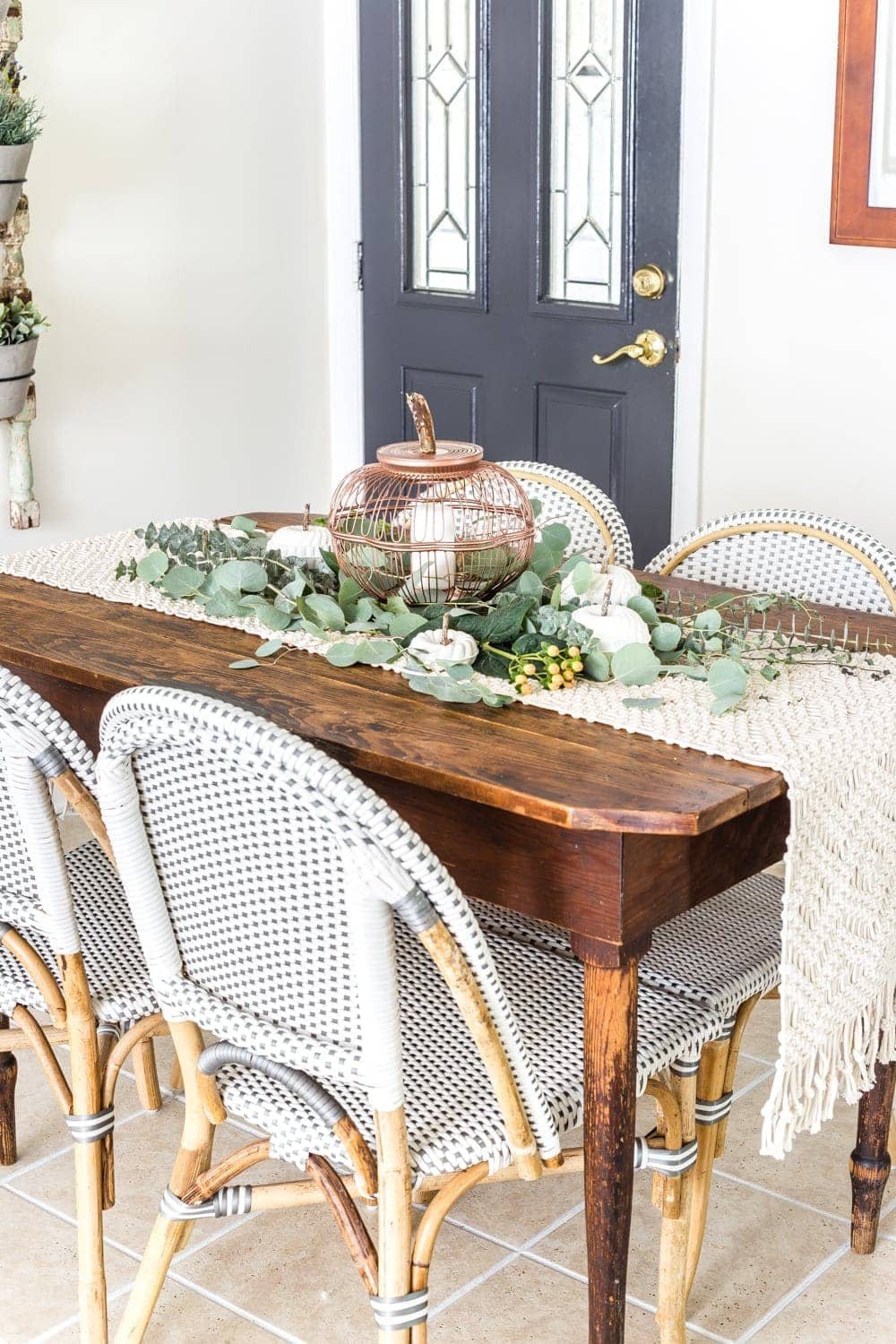 fall centerpiece using thrifted wire bread baskets and DIY craft pumpkins