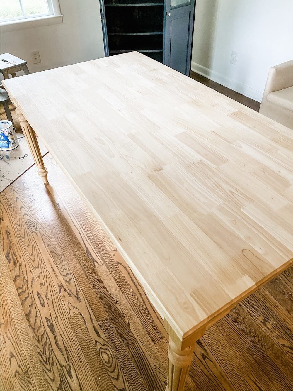 A budget-friendly option for customizing furniture to work in any space using unfinished, solid wood pre-built pieces & staining an office work table.