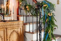Hang Garland on Stairs: Entryway Christmas Decor Ideas