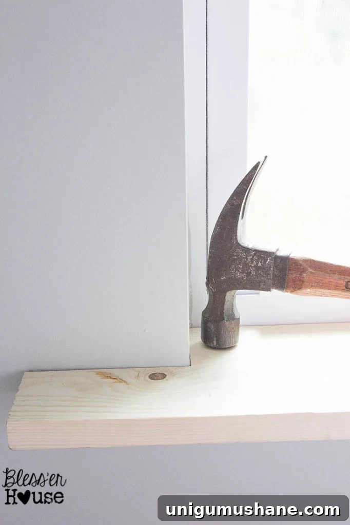 DIY Window Trim: Install Molding Without Miter Cuts 6 setting a sill for window casing using a basic piece of lumber