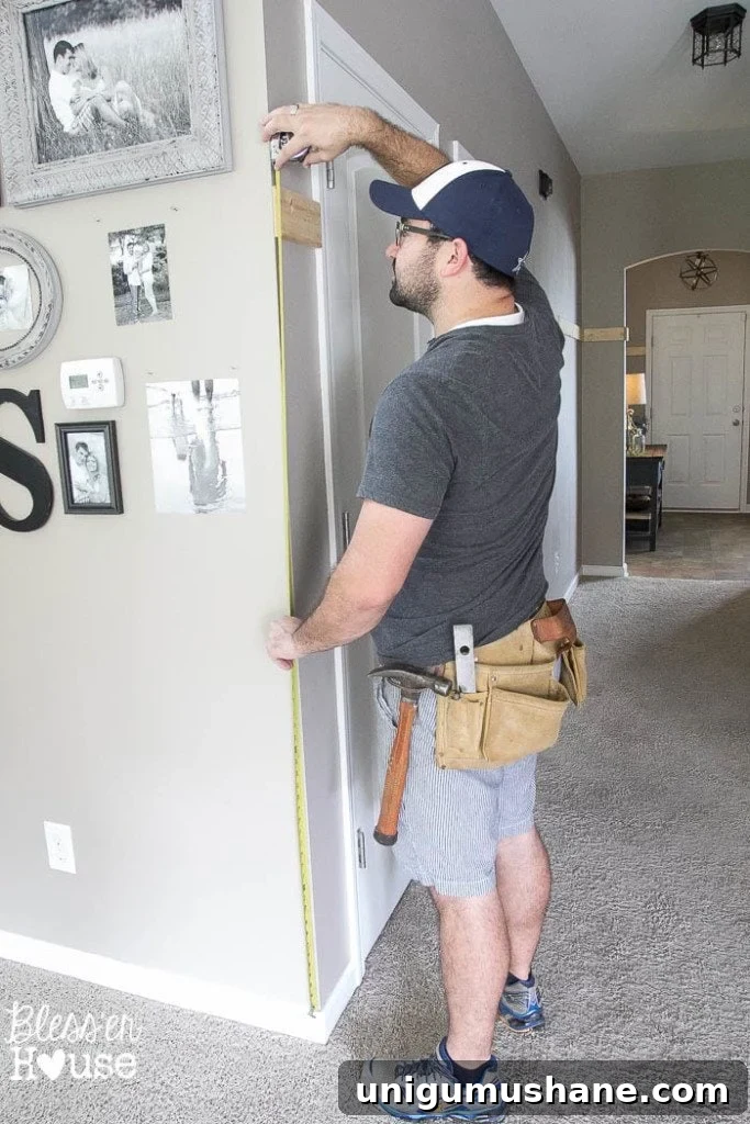 Affordable DIY Board and Batten: Step-by-Step Wall Tutorial 13 measuring height for board and batten