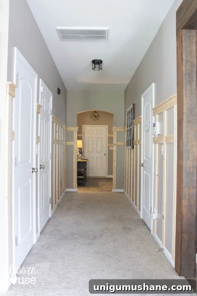 Affordable DIY Board and Batten: Step-by-Step Wall Tutorial 20 adding board and batten wainscoting to a dark hallway with a shelf detail