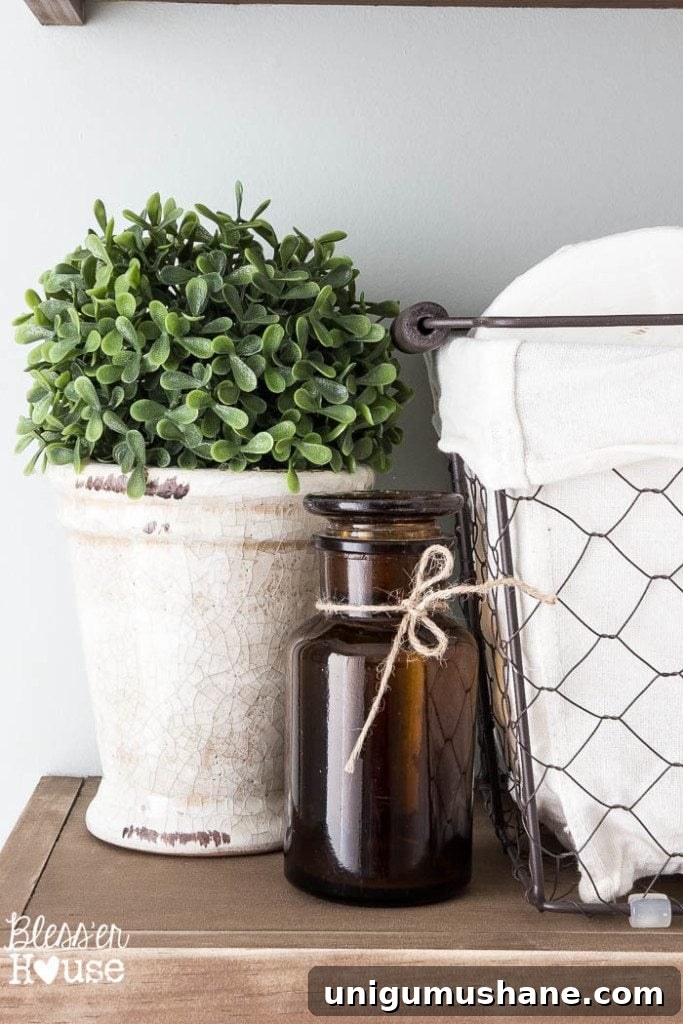 Modern Farmhouse Bathroom Remodel Reveal: Before and After 8 Modern Farmhouse Bathroom Makeover | Bless'er House - So many great ideas to create charm in a builder grade bathroom!