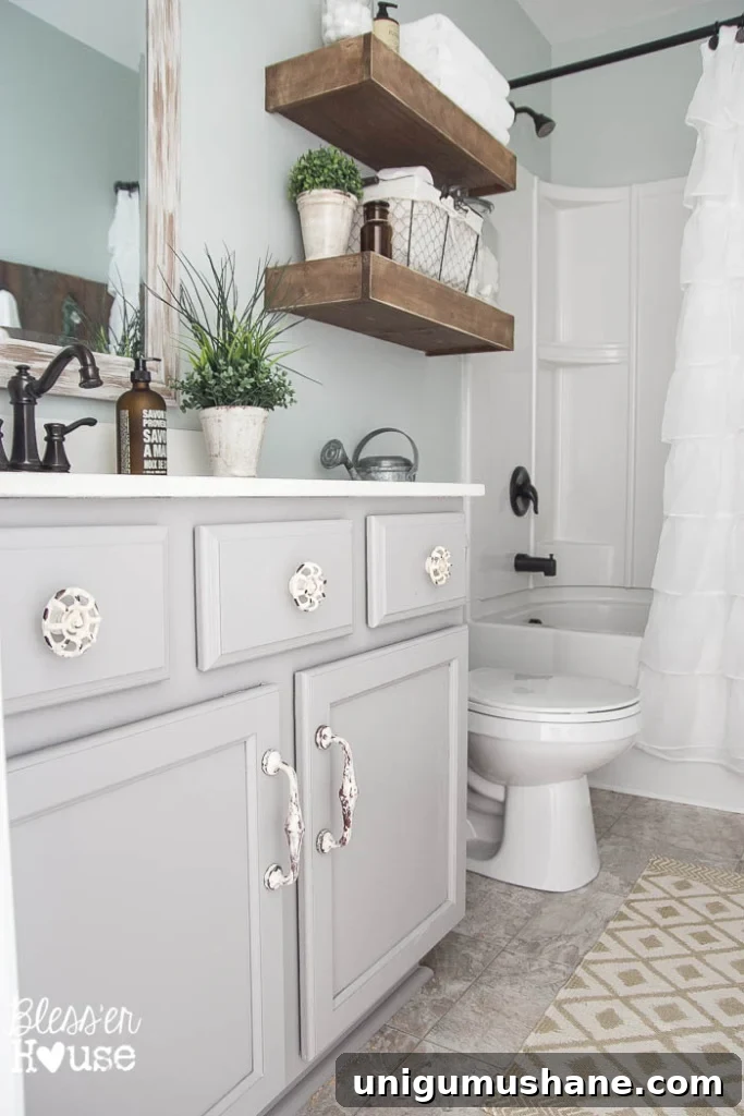 Modern Farmhouse Bathroom Remodel Reveal: Before and After 11 Modern Farmhouse Bathroom Makeover | Bless'er House - So many great ideas to create charm in a builder grade bathroom!