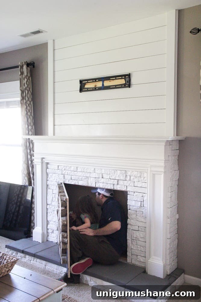 Modern DIY Faux Fireplace Makeover 3 DIY Faux Fireplace Updated | blesserhouse.com - This fireplace looks so real and it cost about $600 to build!