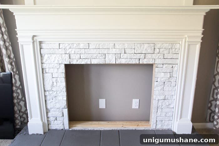 Modern DIY Faux Fireplace Makeover 5 DIY Faux Fireplace Updated | blesserhouse.com - This fireplace looks so real and it cost about $600 to build!