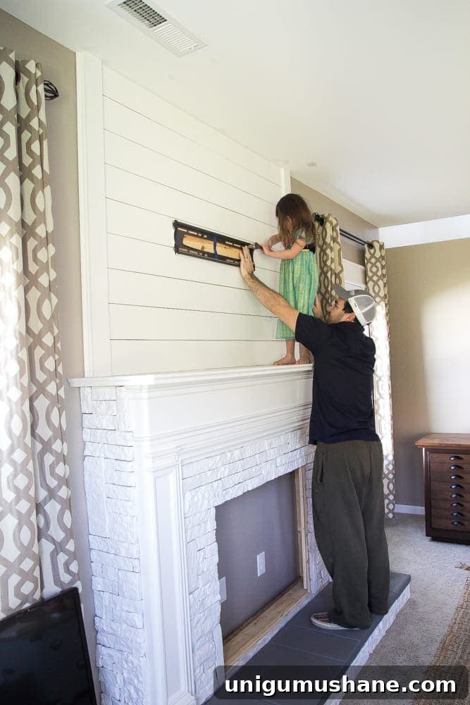 Modern DIY Faux Fireplace Makeover 6 DIY Faux Fireplace Updated | blesserhouse.com - This fireplace looks so real and it cost about $600 to build!