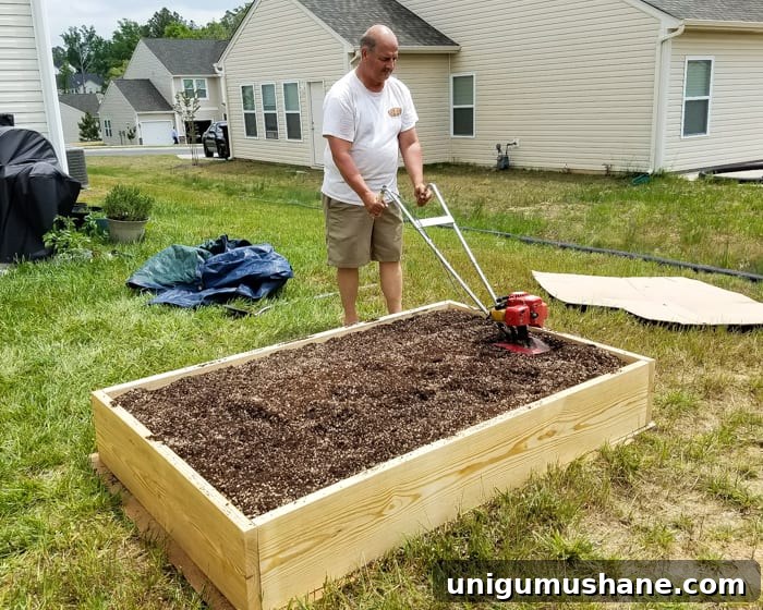 How to Grow a High Yield Raised Bed Vegetable Garden 10 tilling soil mixture for preparing a raised bed vegetable garden frame