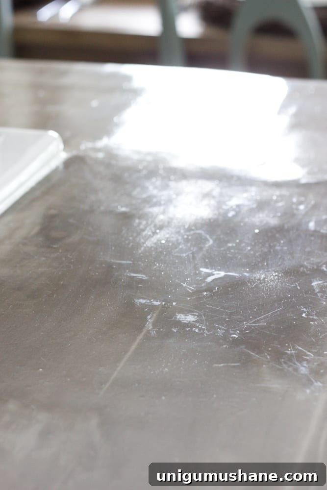 Concrete Countertops: Pros, Cons, and Common Problems 6 Reapplying sealer to concrete countertop
