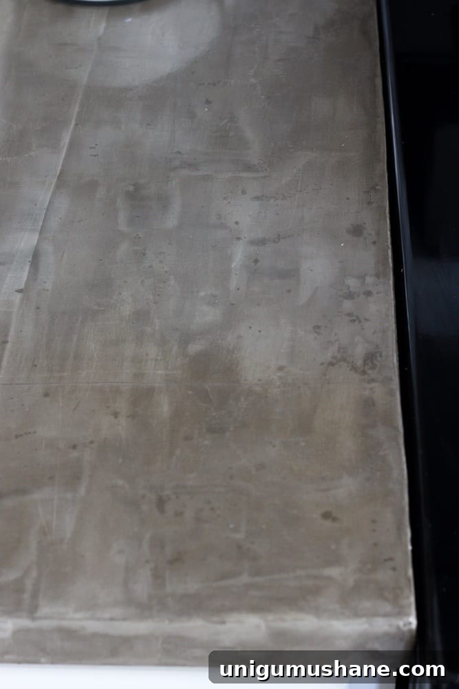 Concrete Countertops: Pros, Cons, and Common Problems 8 Heavily stained section of concrete counter