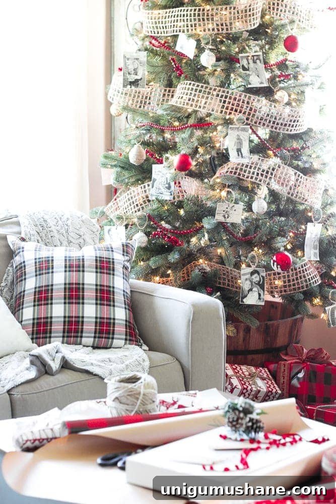 Cozy Christmas Living Room Tour with Holiday Decor Ideas 11 Farmhouse Christmas tree with burlap ribbon, rustic garland, and wrapped gifts.