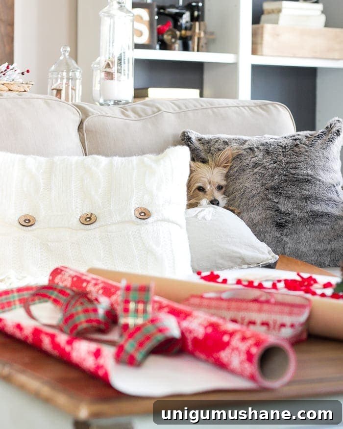 Cozy Christmas Living Room Tour with Holiday Decor Ideas 14 Cozy sofa with plaid pillows and faux fur throw in a farmhouse Christmas living room.