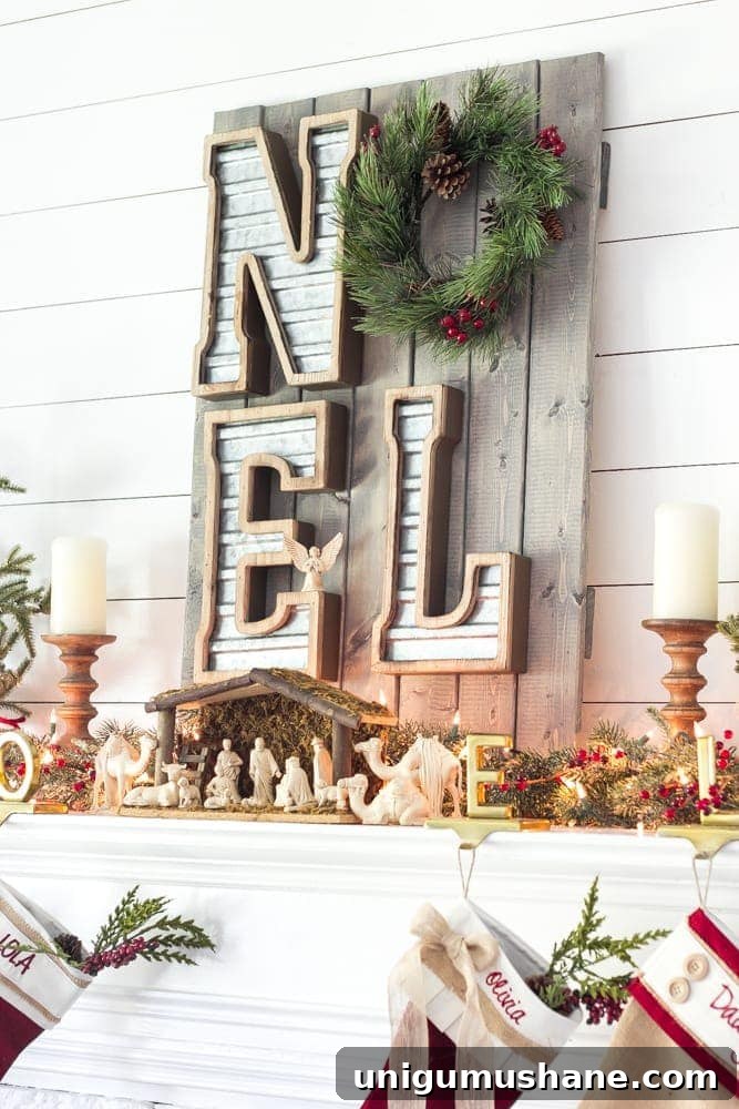 Cozy Christmas Living Room Tour with Holiday Decor Ideas 16 Christmas mantel with a peaceful holiday message, greenery, stockings, and farmhouse decorations.