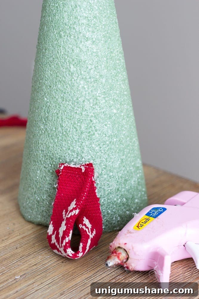 How to Make Nordic Sweater Mini Christmas Trees 8 DIY Nordic Sweater Mini Christmas Trees | blesserhouse.com - How to make Nordic sweater mini Christmas trees using just florist foam, ribbon, and hot glue for cute decor accents on tabletops and mantels.