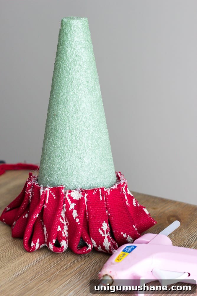 How to Make Nordic Sweater Mini Christmas Trees 9 DIY Nordic Sweater Mini Christmas Trees | blesserhouse.com - How to make Nordic sweater mini Christmas trees using just florist foam, ribbon, and hot glue for cute decor accents on tabletops and mantels.