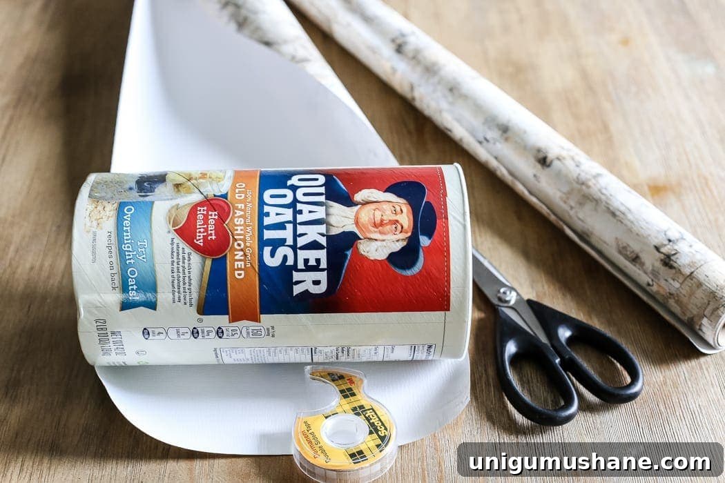 How to Make a Birch Bark Vase for Rustic Home Decor 3 DIY Birch Bark Vase from an Oatmeal Can | blesserhouse.com - A quick tutorial for how to make a DIY birch bark vase for cheap using items from your pantry to create a cozy style for displaying faux florals.