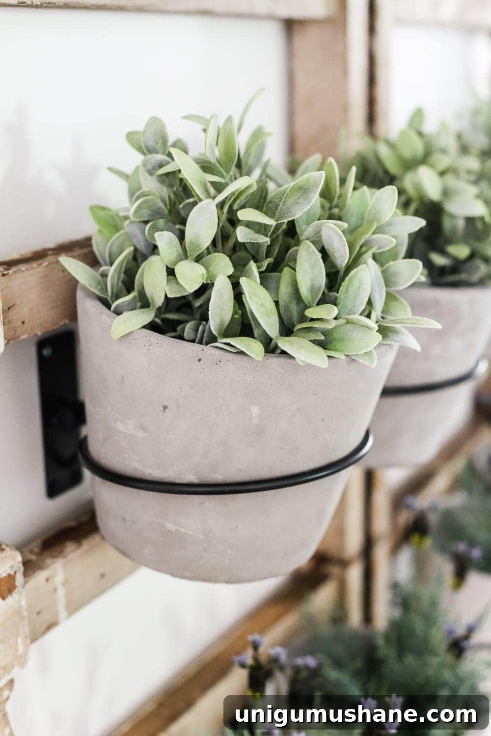 Antique Banister Wall Planter for Charming Staircase Decor 5 DIY Antique Banister Wall Planter | www.blesserhouse.com - A quick and simple tutorial for how to make a wall planter from a repurposed antique banister using artificial plants. Cute way to bring the outdoors in!