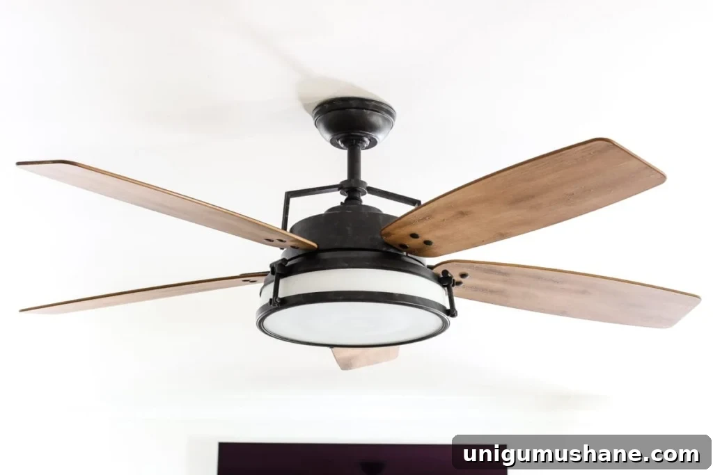 How to Replace a Ceiling Fan in Your Living Room 2 Living Room Update: Ceiling Fan Swap | blesserhouse.com - A bland, boring living room gets a makeover with a modern industrial farmhouse style ceiling fan - Casablanca Caneel Bay.