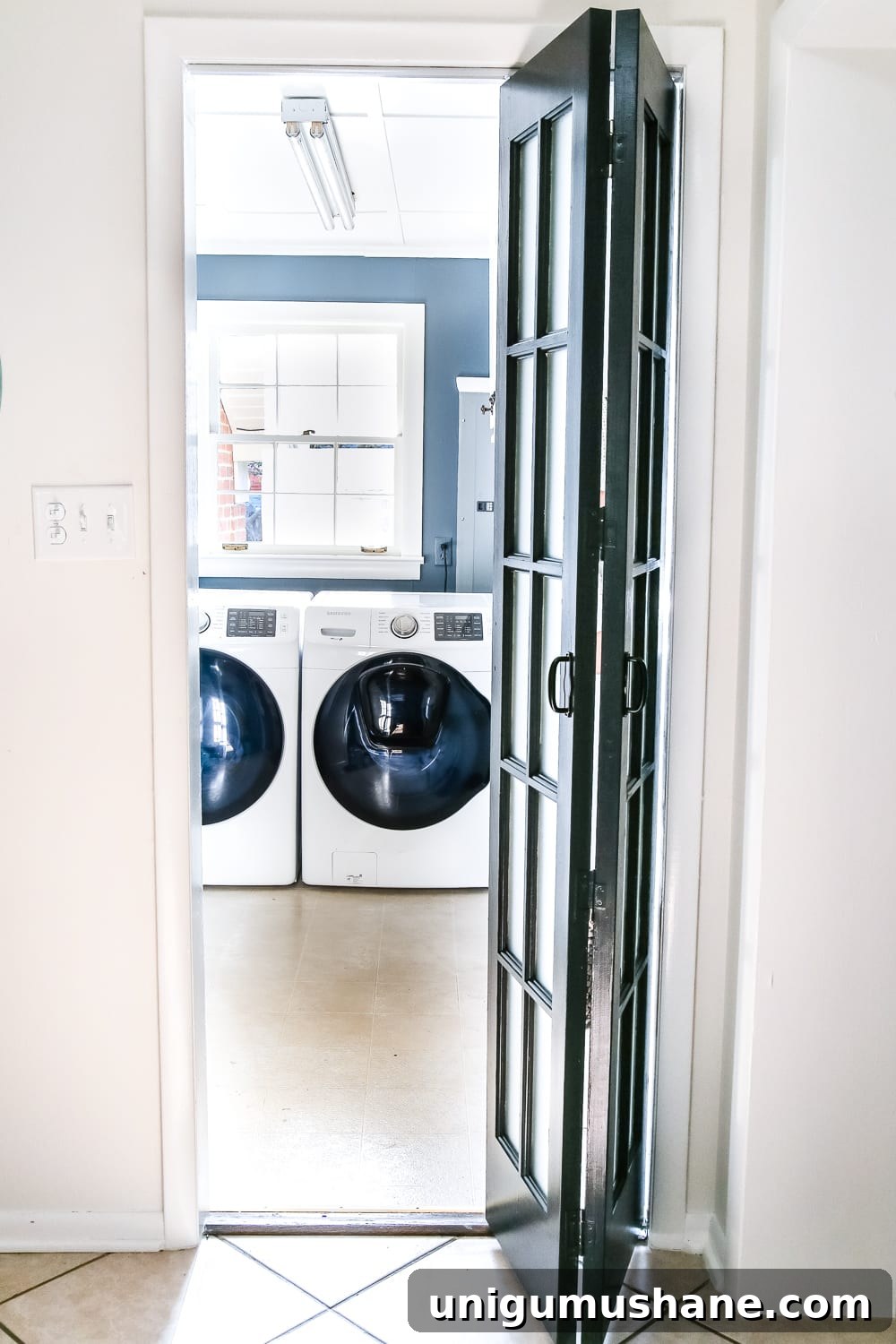 Transform Your Laundry Room with a French Bifold Door 3 Laundry Room Updates: French Bifold Door | blesserhouse.com - A rickity laundry room bifold door gets a beautiful and functional update with a French bifold door with frosted glass for hiding messes in a stylish way.